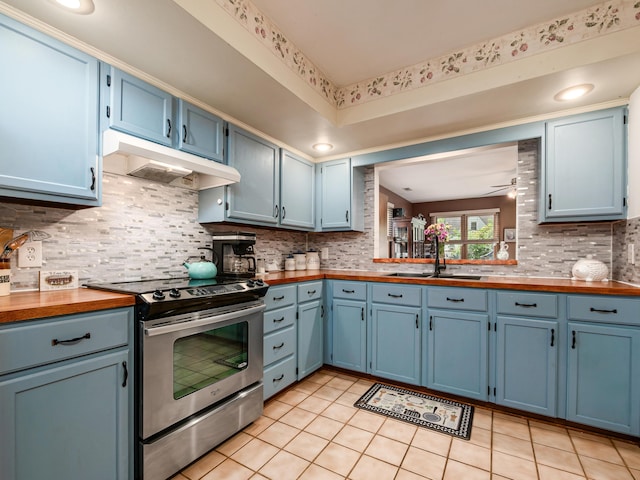 4005 Curtis Ave, Grove City, OH 43123 - kitchen featuring electric stove, blue cabinets, under cabinet range hood, and light tile patterned flooring