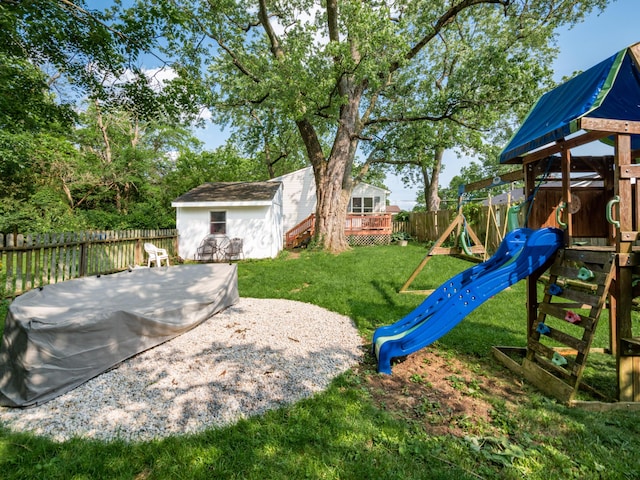 4005 Curtis Ave, Grove City, OH 43123 - fenced backyard with a playground, an outbuilding, and a deck