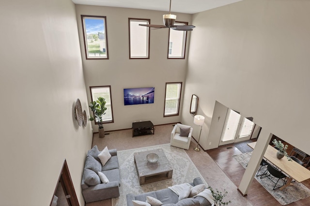 101 Stirling Way, Etna, OH 43062 - living room featuring a ceiling fan, a high ceiling, and wood finished floors