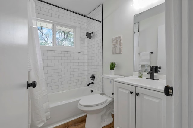 2870 Hamilton Ave, Columbus, OH 43224 - full bathroom featuring shower / bath combo, vanity, and wood finished floors