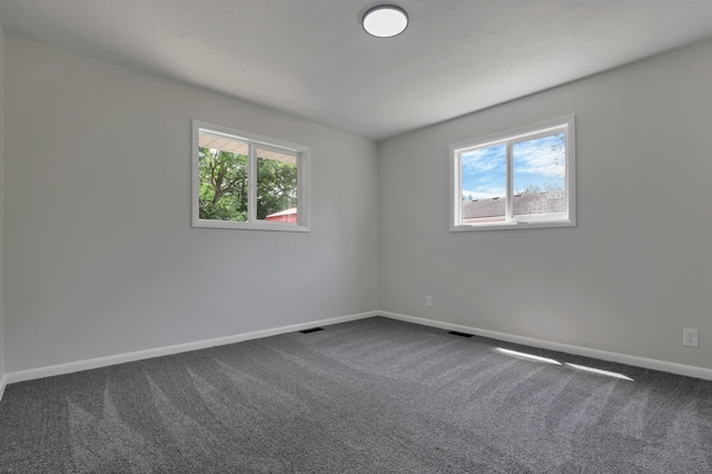 2870 Hamilton Ave, Columbus, OH 43224 - unfurnished room featuring dark colored carpet