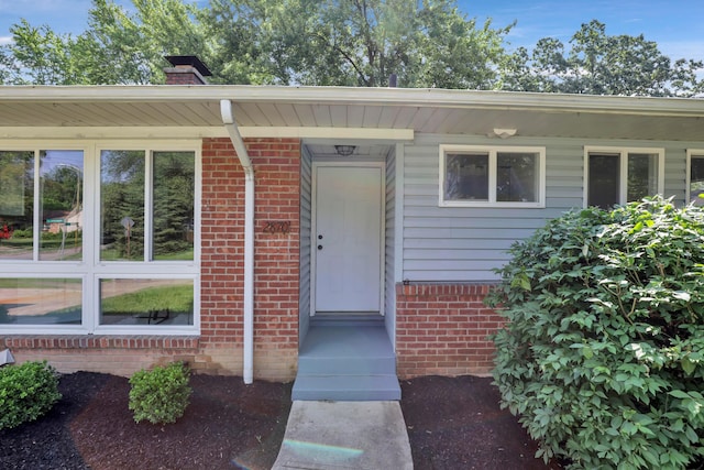 2870 Hamilton Ave, Columbus, OH 43224 - entrance to property with a chimney and brick siding