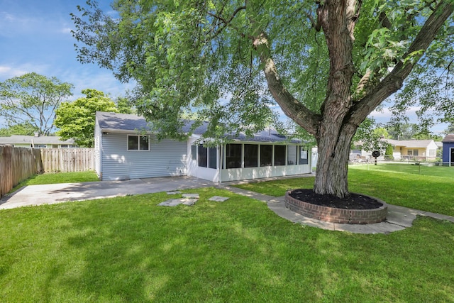 2870 Hamilton Ave, Columbus, OH 43224 - back of property with a sunroom and a patio