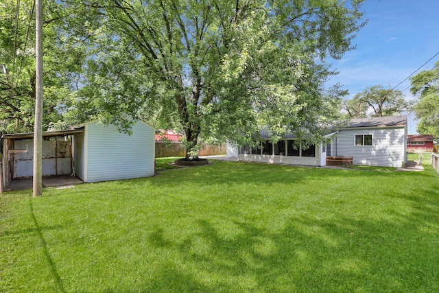 2870 Hamilton Ave, Columbus, OH 43224 - view of yard featuring a sunroom and an outbuilding