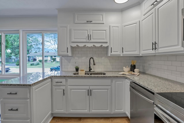 2870 Hamilton Ave, Columbus, OH 43224 - kitchen featuring dishwasher, white cabinets, crown molding, decorative backsplash, and light stone counters