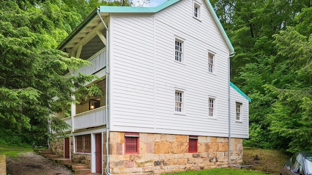 24000 State Route 180, Rockbridge, OH 43149 - view of home's exterior featuring a balcony