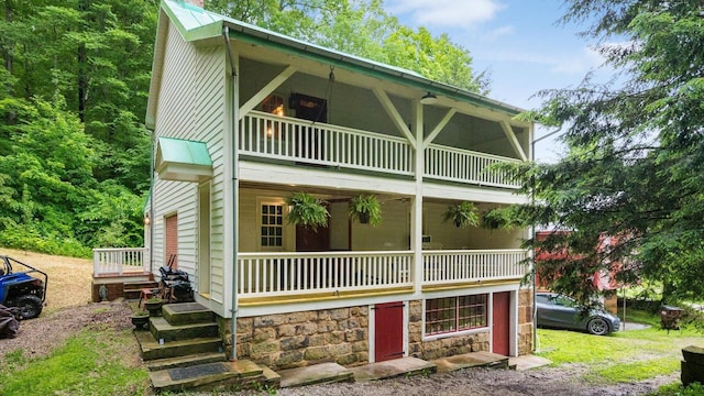 24000 State Route 180, Rockbridge, OH 43149 - view of front of home with a balcony