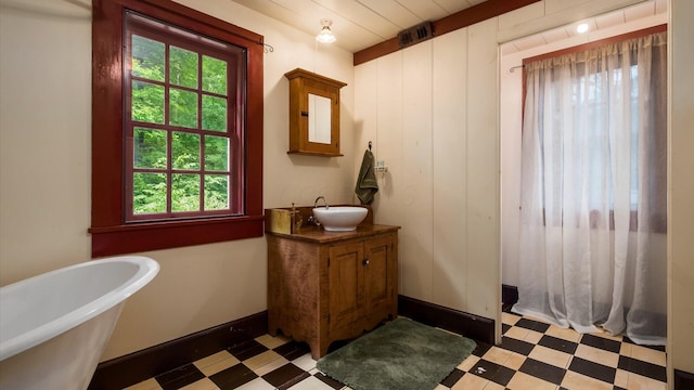 24000 State Route 180, Rockbridge, OH 43149 - full bathroom with tile patterned floors, vanity, and a freestanding bath