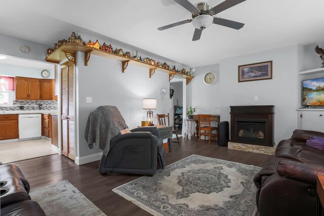 568 Swackhammer Rd, Circleville, OH 43113 - living area with wood finished floors, a glass covered fireplace, and ceiling fan