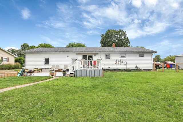 568 Swackhammer Rd, Circleville, OH 43113 - rear view of house with a patio, a yard, a deck, and a chimney
