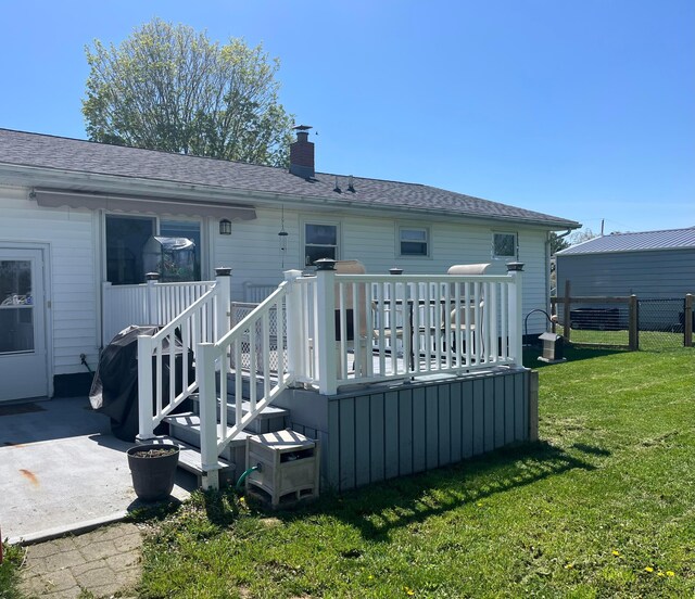 568 Swackhammer Rd, Circleville, OH 43113 - rear view of property featuring a wooden deck, a chimney, and a shingled roof