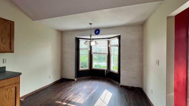 1080 Oxford Dr N, Pataskala, OH 43062 - unfurnished dining area featuring dark wood-style flooring and a chandelier