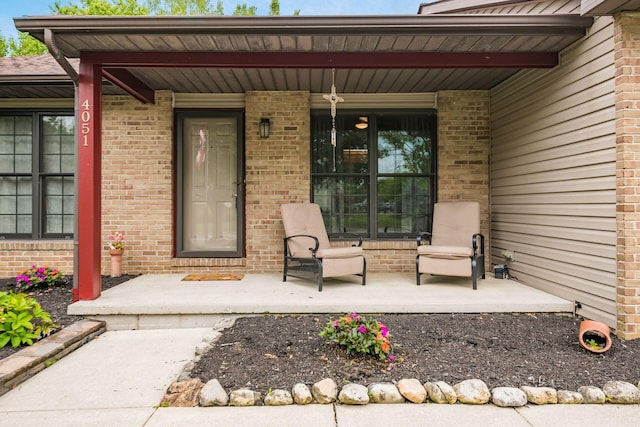 4051 Tamarack Ave, Grove City, OH 43123 - view of exterior entry featuring a porch and brick siding