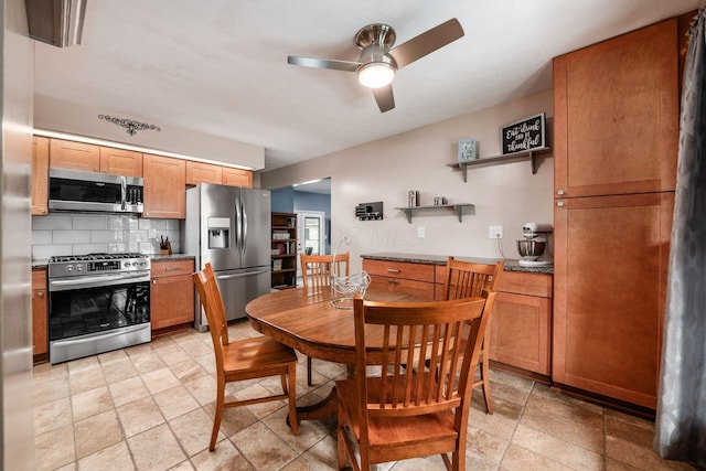 4051 Tamarack Ave, Grove City, OH 43123 - dining area featuring a ceiling fan and stone tile floors