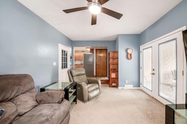 4051 Tamarack Ave, Grove City, OH 43123 - living area with french doors, light carpet, and a ceiling fan