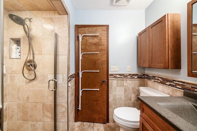 4051 Tamarack Ave, Grove City, OH 43123 - full bathroom with vanity, a shower stall, tile walls, and a wainscoted wall