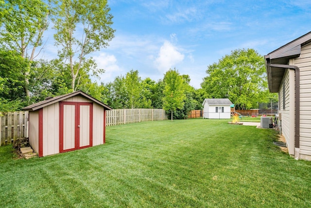4051 Tamarack Ave, Grove City, OH 43123 - fenced backyard featuring a storage shed and view of scattered trees