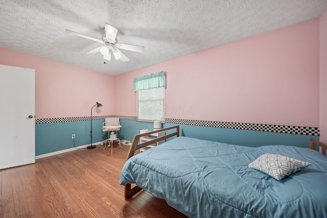 816 Coss Cir, Westerville, OH 43081 - bedroom with wood finished floors, a ceiling fan, and a textured ceiling