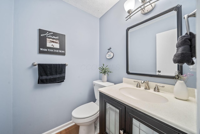 816 Coss Cir, Westerville, OH 43081 - half bath featuring vanity, wood finished floors, and a textured ceiling