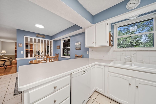 816 Coss Cir, Westerville, OH 43081 - kitchen featuring white dishwasher, light tile patterned floors, a peninsula, white cabinetry, and light countertops