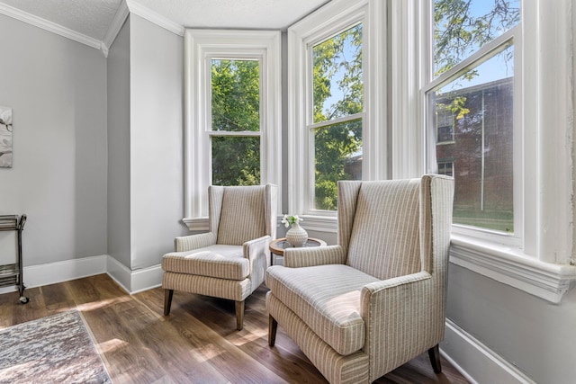 264 W High St, Mount Gilead, OH 43338 - sitting room with plenty of natural light, ornamental molding, and wood finished floors