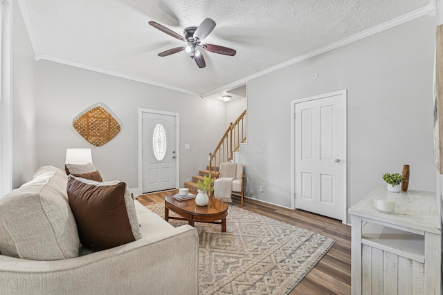 264 W High St, Mount Gilead, OH 43338 - living room with ceiling fan, crown molding, wood finished floors, stairway, and a textured ceiling