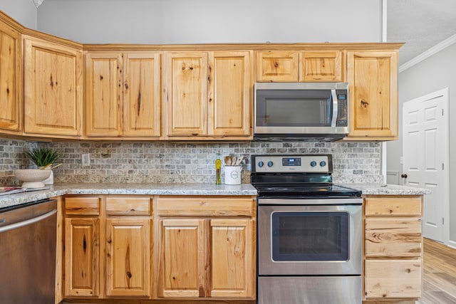 264 W High St, Mount Gilead, OH 43338 - kitchen featuring stainless steel appliances, ornamental molding, tasteful backsplash, light wood-type flooring, and light brown cabinetry