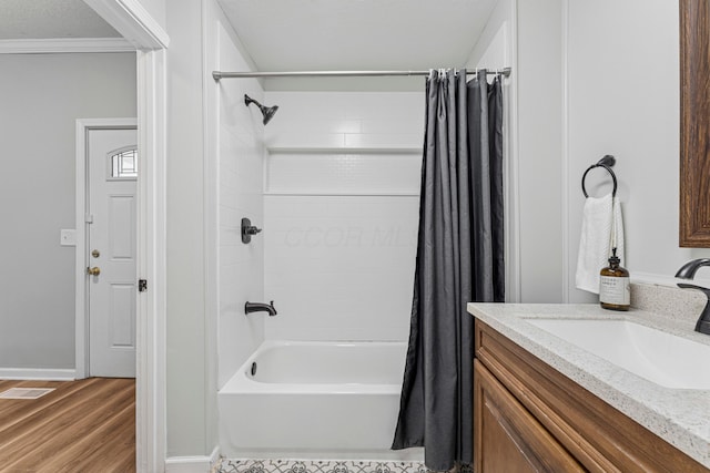 264 W High St, Mount Gilead, OH 43338 - bathroom featuring shower / bath combo, wood finished floors, vanity, and ornamental molding