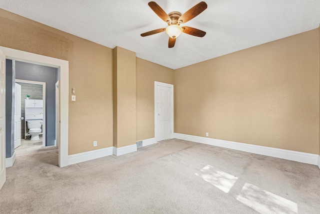 264 W High St, Mount Gilead, OH 43338 - unfurnished bedroom featuring light colored carpet, ceiling fan, and a textured ceiling