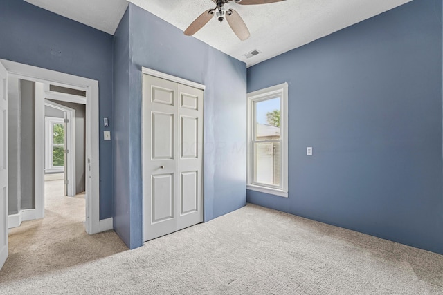 264 W High St, Mount Gilead, OH 43338 - unfurnished bedroom featuring carpet floors, a closet, and ceiling fan