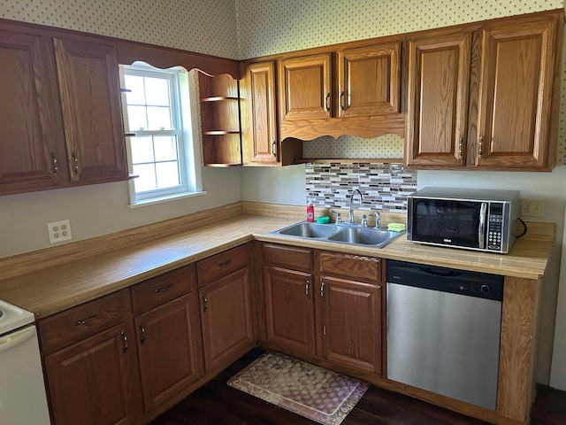 12317 State Route 188, Thornville, OH 43076 - kitchen featuring stainless steel dishwasher, black microwave, light countertops, brown cabinets, and tasteful backsplash