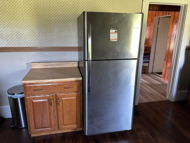 12317 State Route 188, Thornville, OH 43076 - kitchen with freestanding refrigerator, dark wood-style floors, and brown cabinets