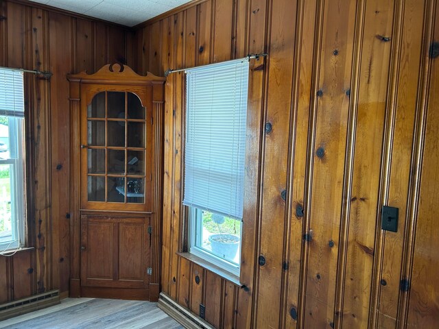 12317 State Route 188, Thornville, OH 43076 - entryway with a baseboard radiator, wooden walls, and light wood finished floors