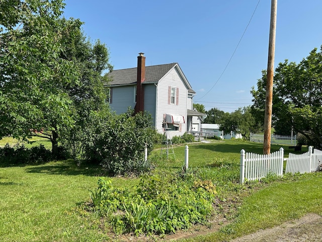 12317 State Route 188, Thornville, OH 43076 - view of side of home featuring a chimney