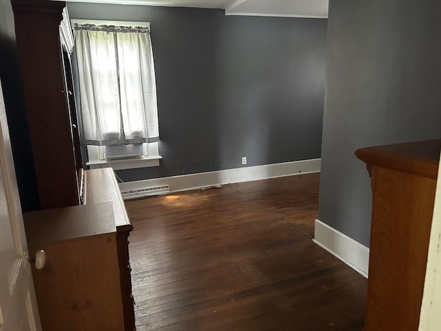 12317 State Route 188, Thornville, OH 43076 - empty room with wood-type flooring, cooling unit, and a baseboard heating unit