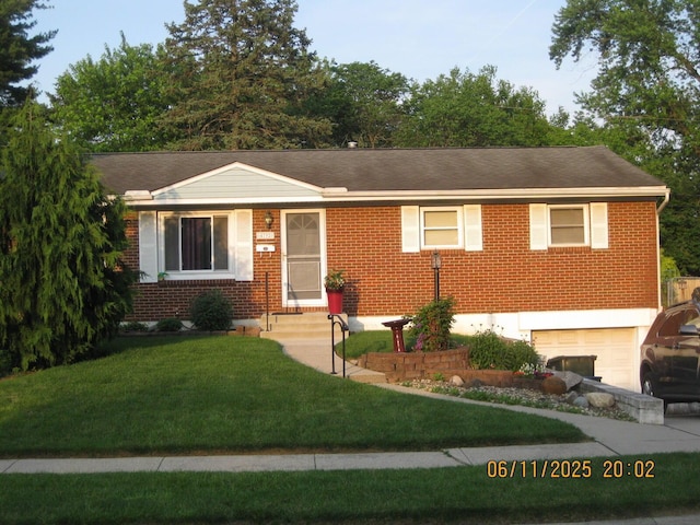 4792 Mcfadden Rd, Columbus, OH 43229 - single story home with a garage, brick siding, and a front lawn
