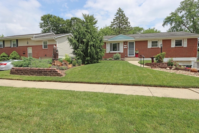 4792 Mcfadden Rd, Columbus, OH 43229 - ranch-style home featuring brick siding and a front yard