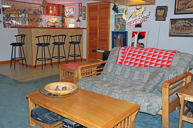 4792 Mcfadden Rd, Columbus, OH 43229 - carpeted living area featuring a bar