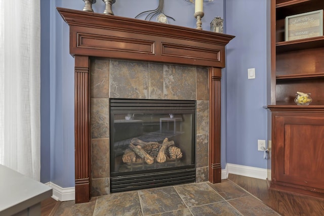 5685 Slater Rdg, Hilliard, OH 43026 - detailed view of baseboards and a tiled fireplace