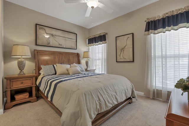 5685 Slater Rdg, Hilliard, OH 43026 - bedroom featuring multiple windows, light colored carpet, and ceiling fan