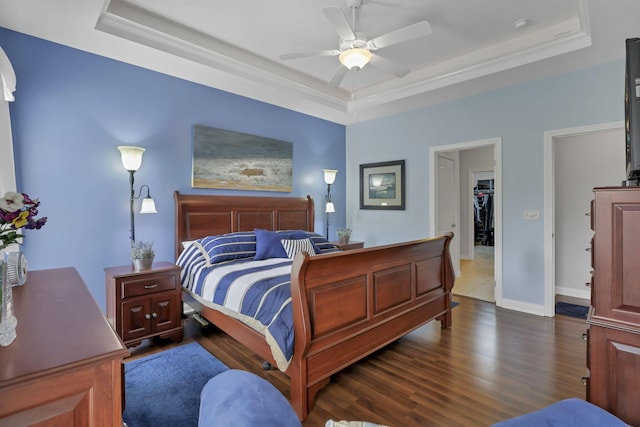 5685 Slater Rdg, Hilliard, OH 43026 - bedroom with a tray ceiling, dark wood finished floors, ornamental molding, and ceiling fan