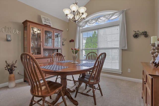5685 Slater Rdg, Hilliard, OH 43026 - dining space featuring plenty of natural light, a chandelier, light colored carpet, and vaulted ceiling