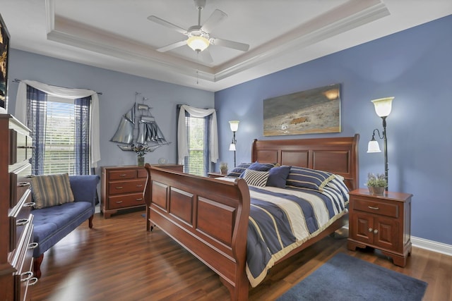 5685 Slater Rdg, Hilliard, OH 43026 - bedroom featuring a raised ceiling, multiple windows, dark wood-style floors, and crown molding