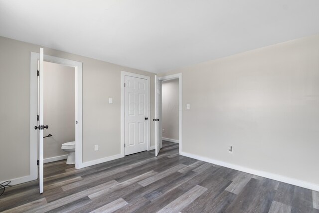 2045 Joyce Ave, Columbus, OH 43219 - unfurnished bedroom featuring wood finished floors and ensuite bath