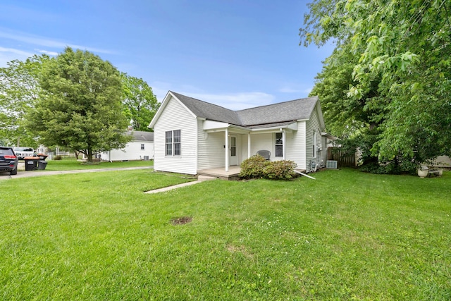 972 Weiant Ave, Newark, OH 43055 - view of side of property featuring a yard, roof with shingles, and covered porch