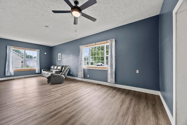 972 Weiant Ave, Newark, OH 43055 - unfurnished room featuring wood finished floors, healthy amount of natural light, a textured ceiling, and a ceiling fan