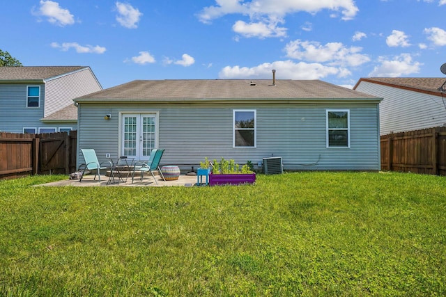 921 Harbinger Cir E, Columbus, OH 43213 - back of house with a patio, a fenced backyard, french doors, and roof with shingles