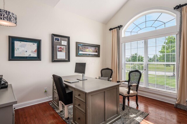 7212 New Albany Links Dr, New Albany, OH 43054 - home office with dark wood finished floors and lofted ceiling