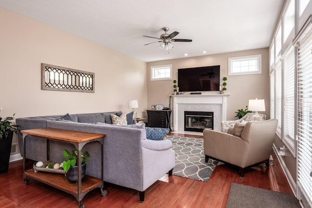 7212 New Albany Links Dr, New Albany, OH 43054 - living area featuring wood finished floors, a fireplace with flush hearth, ceiling fan, and recessed lighting