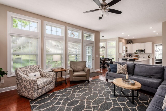 7212 New Albany Links Dr, New Albany, OH 43054 - living area featuring dark wood-style floors, plenty of natural light, a ceiling fan, and recessed lighting